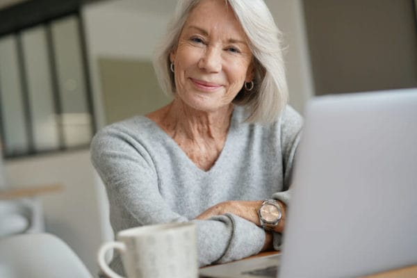 Elderly woman at home with computer Depositphotos_230326768_S What You Do!